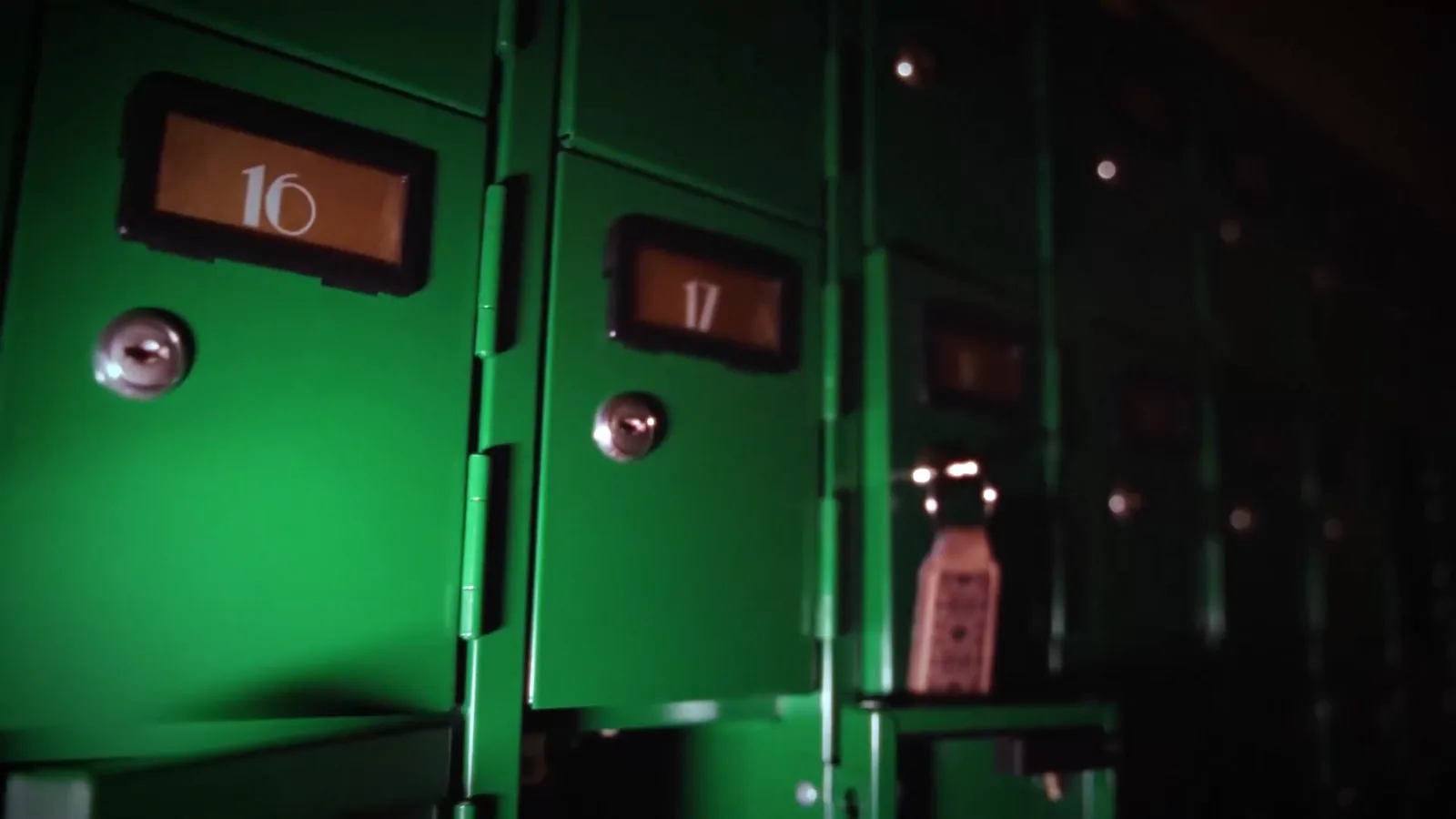 Numbered green safe deposit boxes in the Bank Heist vault
